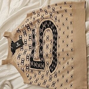 Knitted block and beige tank top